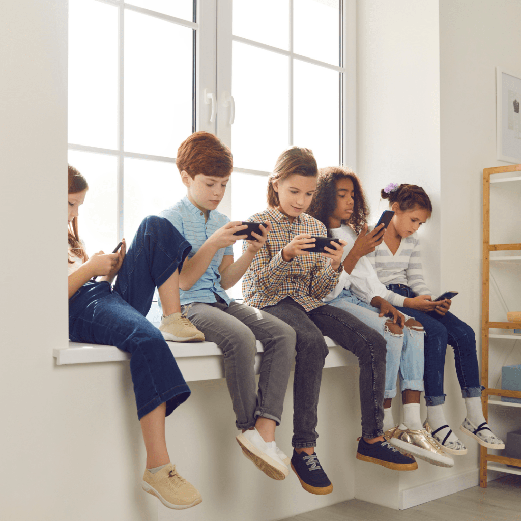 group of gen alpha kids on their phone, classroom